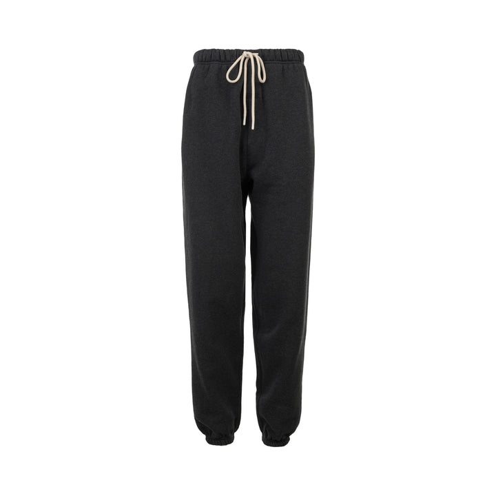 Fear of God Essentials Classic Fleece Sweatpants in dark charcoal with cream drawstring waistband and elasticated ribbed cuffs, flat lay product shot