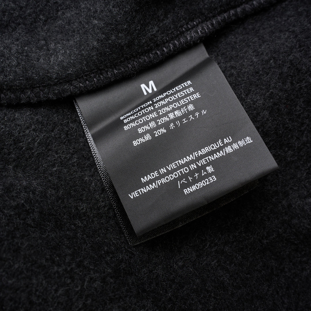 Fear of God Essentials Classic Fleece Sweatpants in dark charcoal with cream drawstring waistband and elasticated ribbed cuffs, flat lay product shot