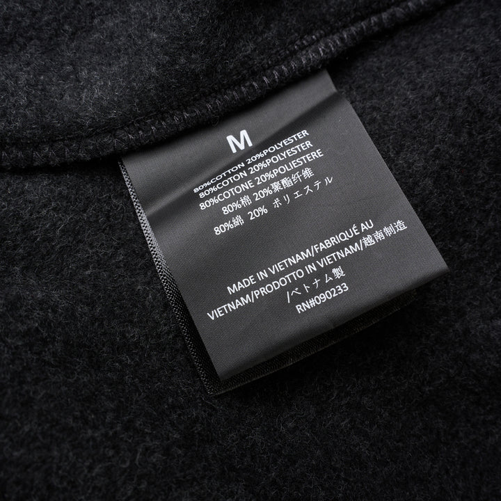 Fear of God Essentials Classic Fleece Sweatpants in dark charcoal with cream drawstring waistband and elasticated ribbed cuffs, flat lay product shot