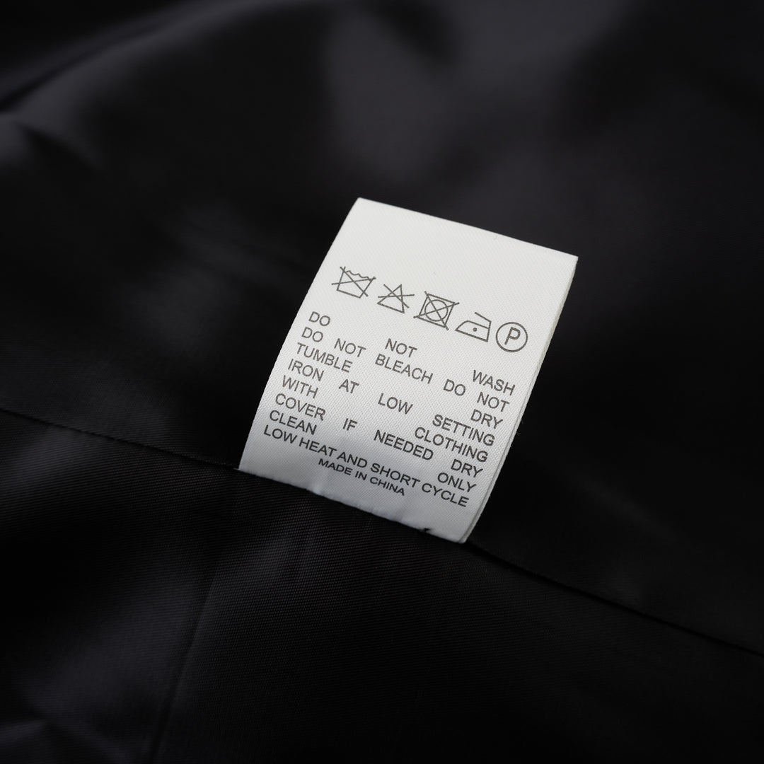 Black cropped collarless jacket in satorial wool mix with asymmetric overlapping front and chest welt pocket - view 4