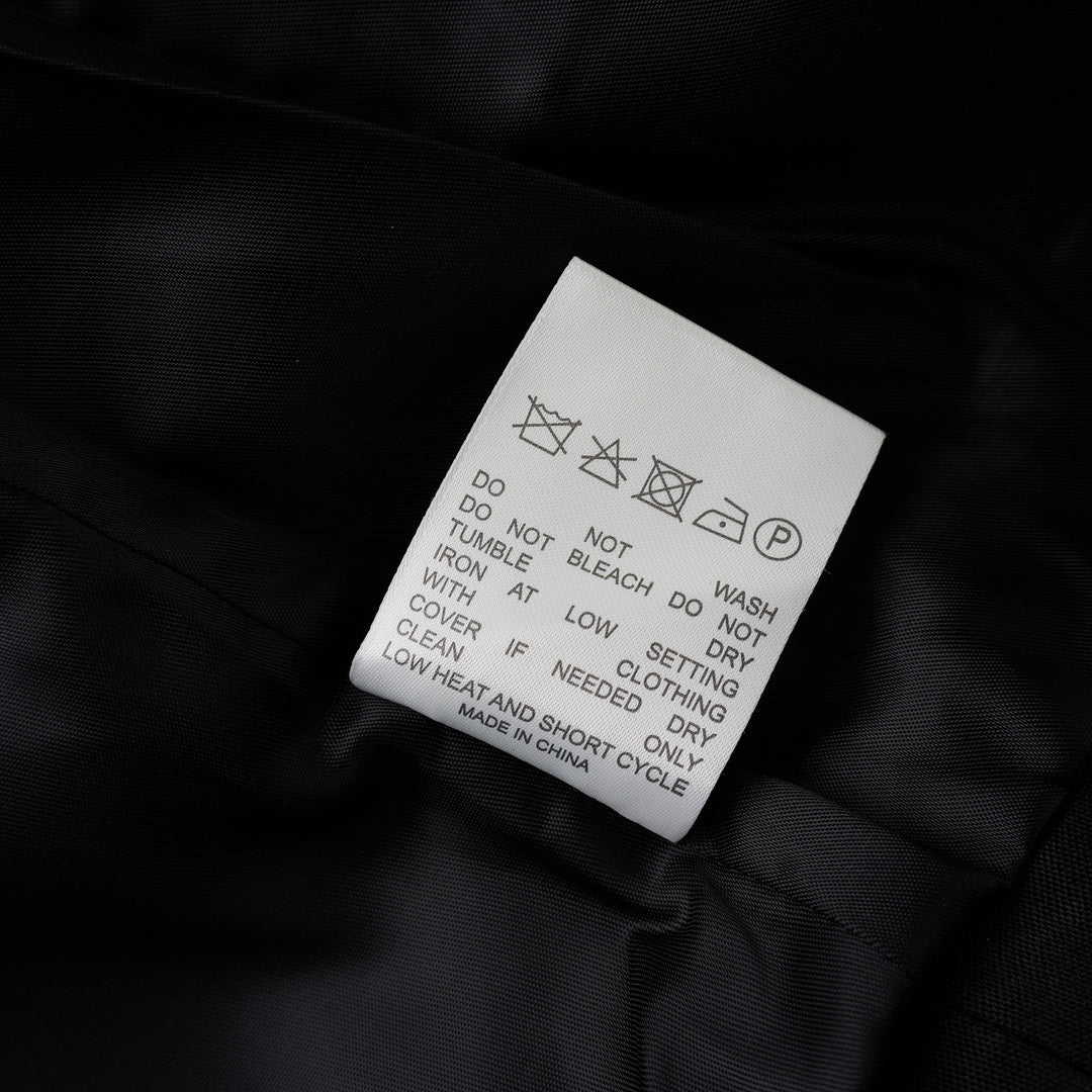 Black cropped blazer with oversized notched lapels, open front and flap pockets in a crinkled steel wire cotton-rayon fabric - view 4