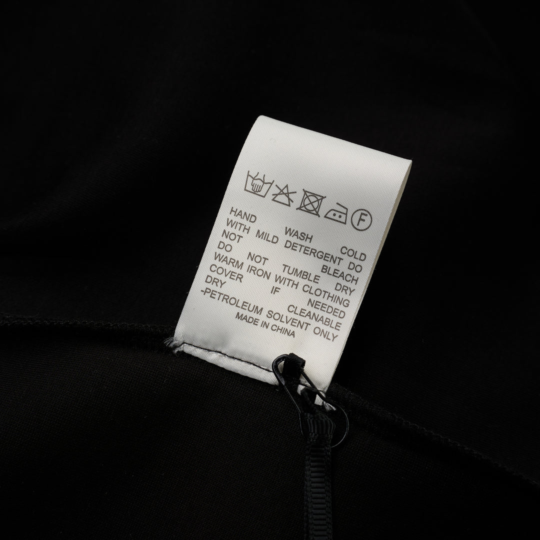 Back view of the Luna sleeveless high-neck midi dress in black stretch modal jersey with a concealed centre back zip - view 4