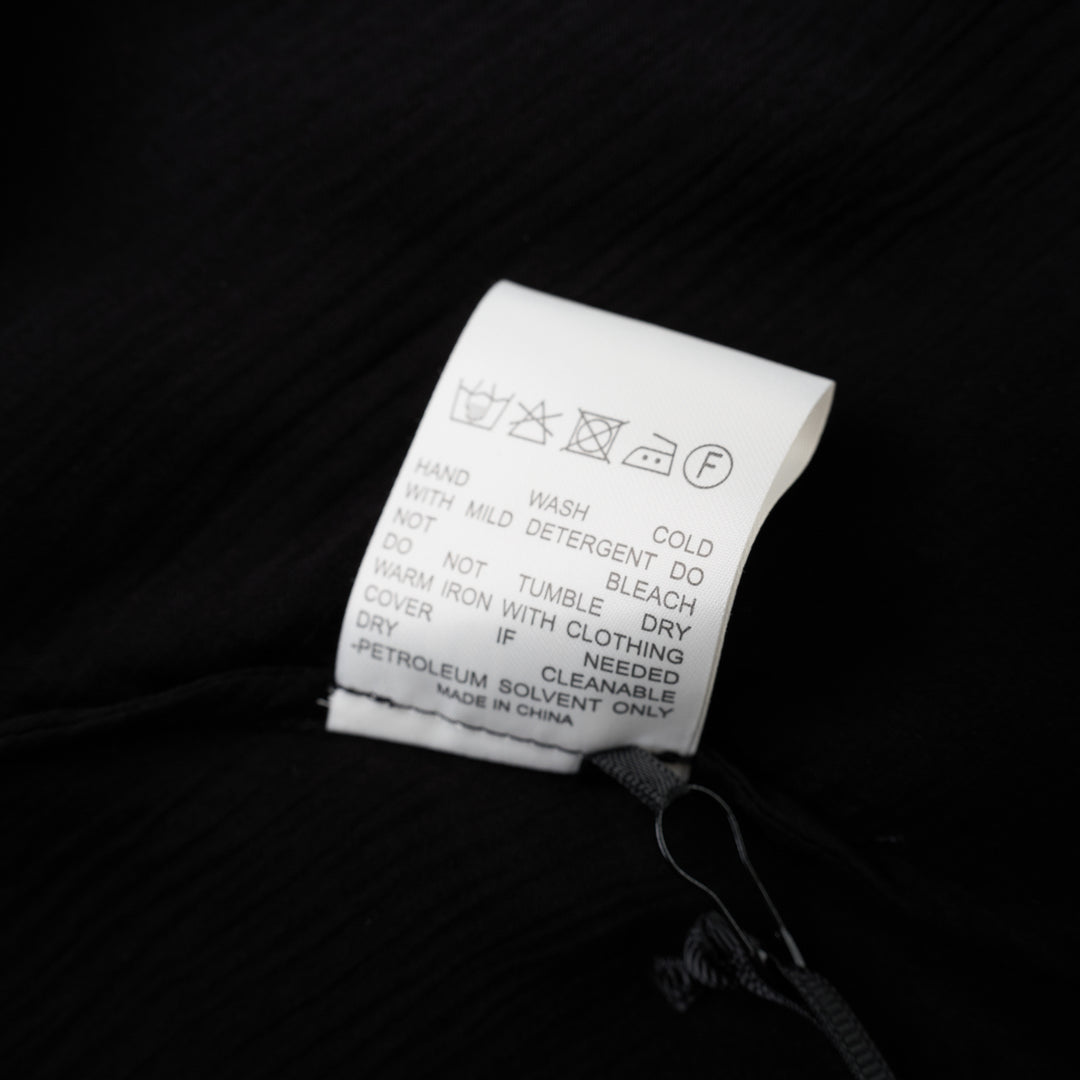 Black sleeveless halter top in crinkled silk-blend fabric with a scooped neckline and self-tie open back - view 4