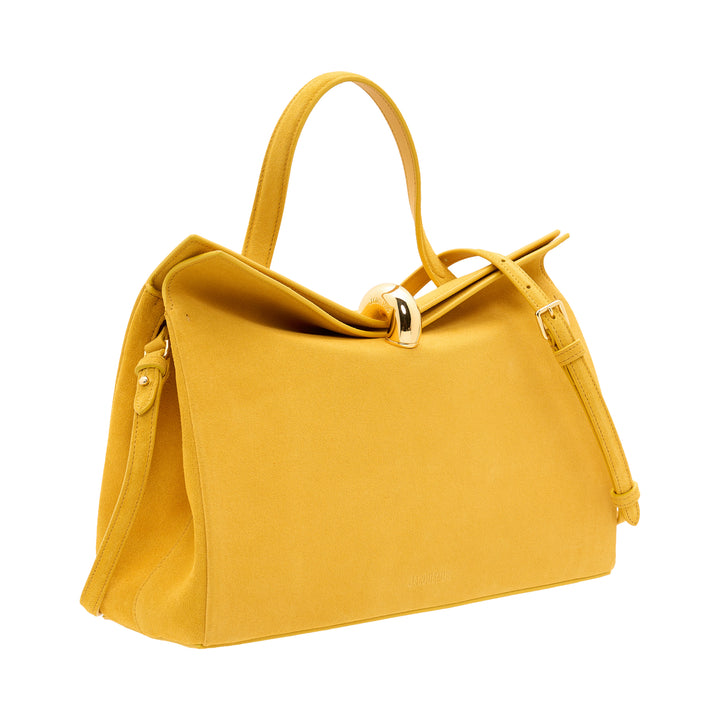 Jacquemus Le Valerie structured tote bag in mustard yellow suede with gold-tone toggle clasp, dual top handles, and adjustable crossbody strap on white background - view 2