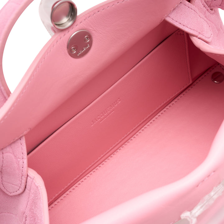 Jacquemus Le Petit Valerie handbag in pink croc-embossed leather with rolled top handle, adjustable crossbody strap, and silver turn-lock closure - view 4