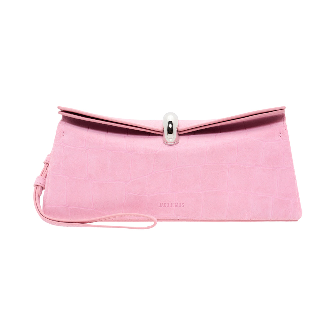Jacquemus La Pochette Valerie envelope clutch in pink croc-embossed leather with a sculptural silver toggle clasp and slim wrist strap