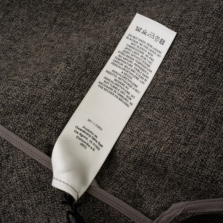 Rick Owens Subhuman sleeveless woven top in dark khaki mélange, featuring an asymmetric draped front panel, tonal crew neck binding, and raw frayed hem, displayed flat on a white background.