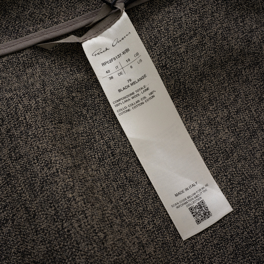 Rick Owens Subhuman sleeveless woven top in dark khaki mélange, featuring an asymmetric draped front panel, tonal crew neck binding, and raw frayed hem, displayed flat on a white background.