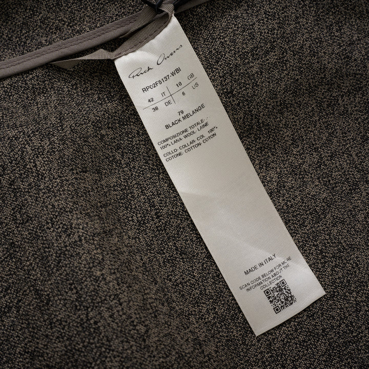 Rick Owens Subhuman sleeveless woven top in dark khaki mélange, featuring an asymmetric draped front panel, tonal crew neck binding, and raw frayed hem, displayed flat on a white background.