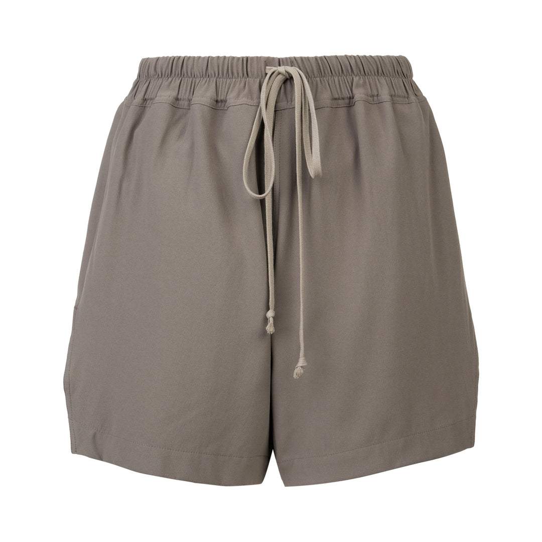 Rick Owens black boxer shorts with elasticated waistband, contrast ecru rope drawstring, and relaxed voluminous silhouette, photographed on a white background