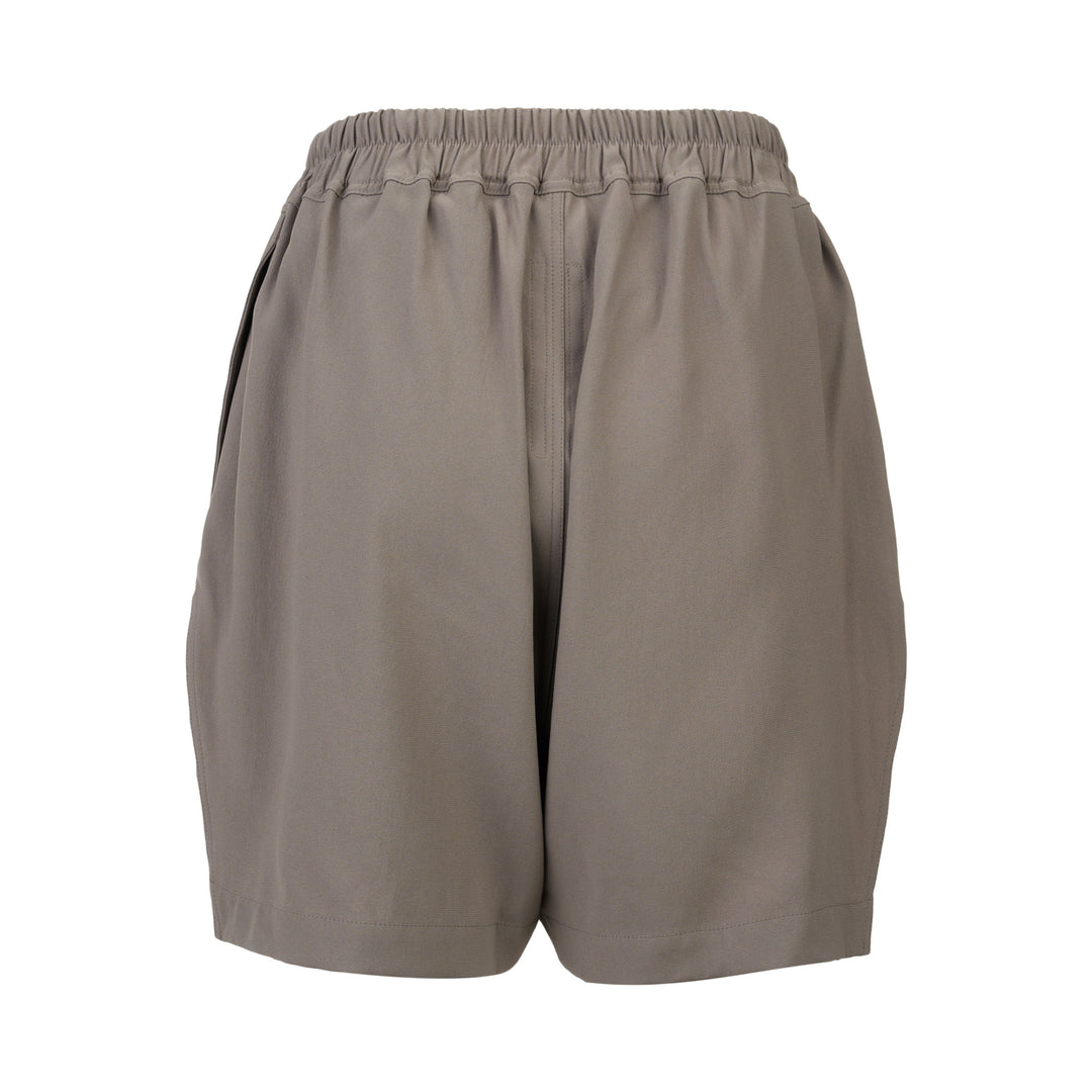 Rick Owens black boxer shorts with elasticated waistband, contrast ecru rope drawstring, and relaxed voluminous silhouette, photographed on a white background
