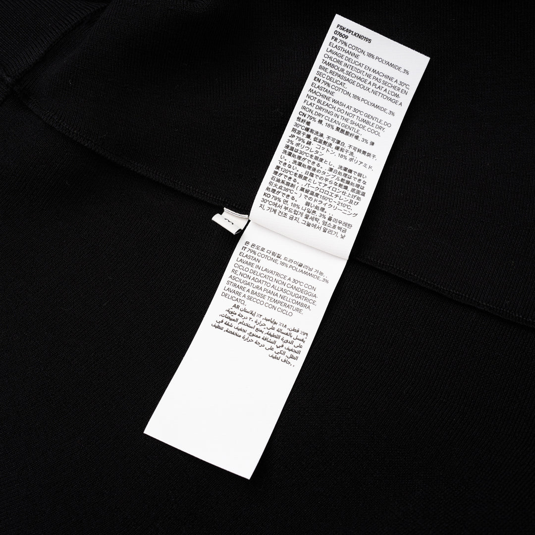 AMI Godet Short Skirt in black, featuring a full circular flared silhouette and wide ribbed waistband, displayed on a white background
