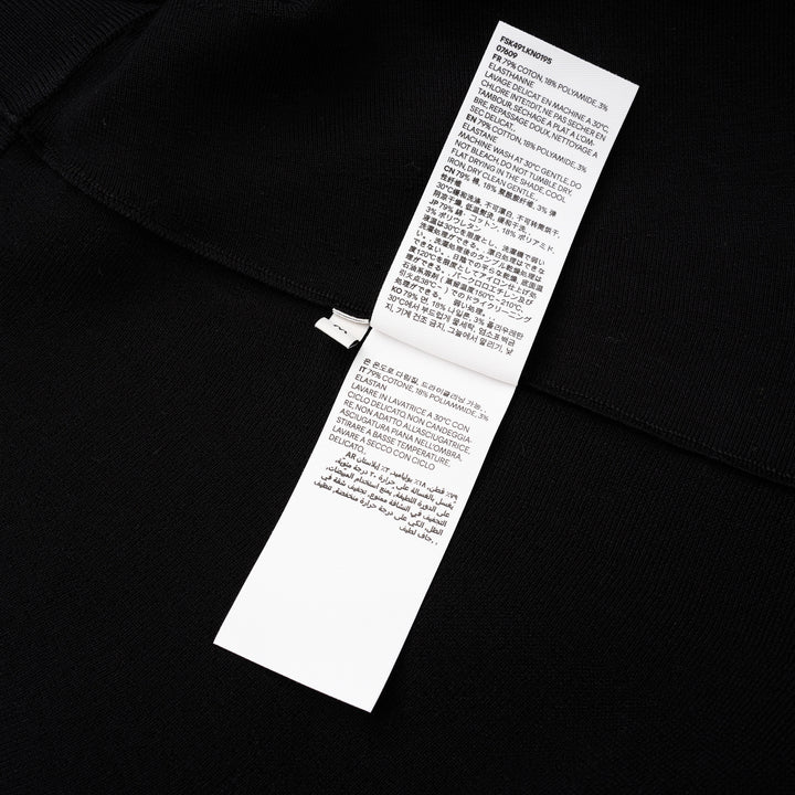 AMI Godet Short Skirt in black, featuring a full circular flared silhouette and wide ribbed waistband, displayed on a white background