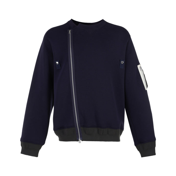 sacai Sponge Sweat Blouson in navy with asymmetric diagonal zip, contrast dark ribbed hem and cuffs, chest snap tabs and off-white sleeve zip pocket