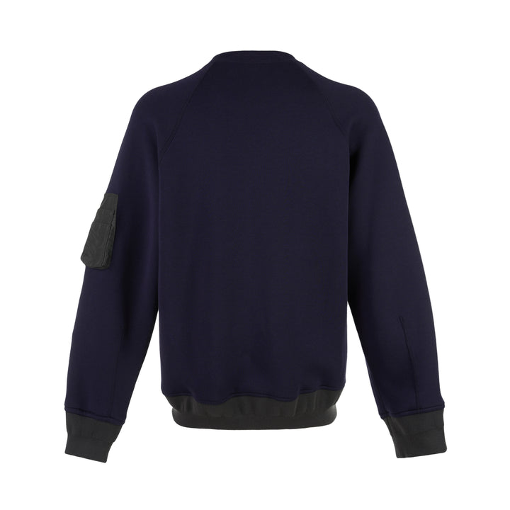 sacai Sponge Sweat Blouson in navy with asymmetric diagonal zip, contrast dark ribbed hem and cuffs, chest snap tabs and off-white sleeve zip pocket - view 2