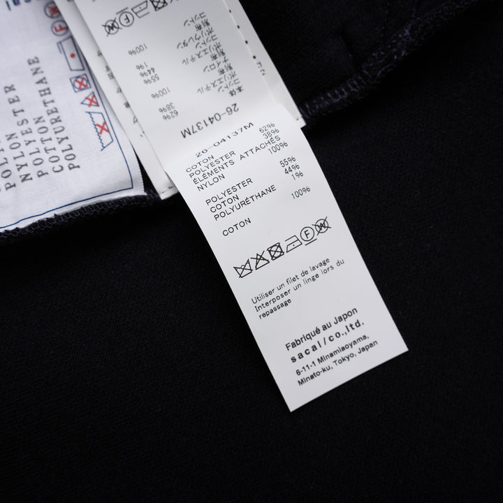 sacai Sponge Sweat Blouson in navy with asymmetric diagonal zip, contrast dark ribbed hem and cuffs, chest snap tabs and off-white sleeve zip pocket - view 4