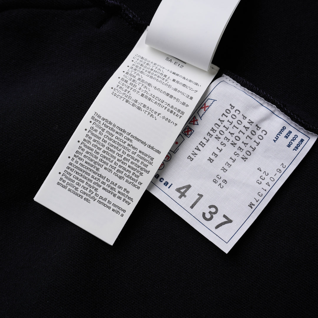 sacai Sponge Sweat Blouson in navy with asymmetric diagonal zip, contrast dark ribbed hem and cuffs, chest snap tabs and off-white sleeve zip pocket - view 5