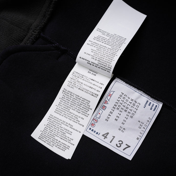 sacai Sponge Sweat Blouson in navy with asymmetric diagonal zip, contrast dark ribbed hem and cuffs, chest snap tabs and off-white sleeve zip pocket - view 6