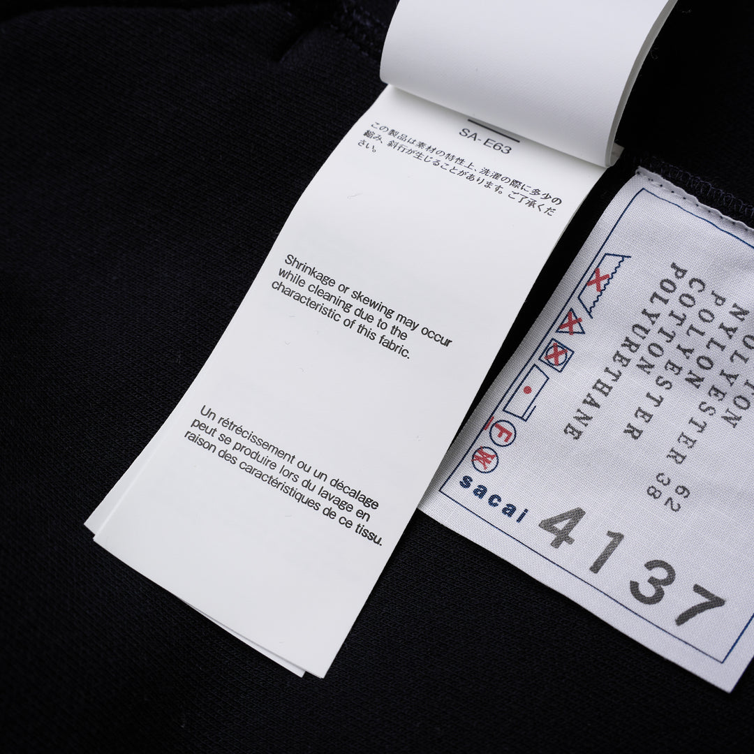 sacai Sponge Sweat Blouson in navy with asymmetric diagonal zip, contrast dark ribbed hem and cuffs, chest snap tabs and off-white sleeve zip pocket - view 7