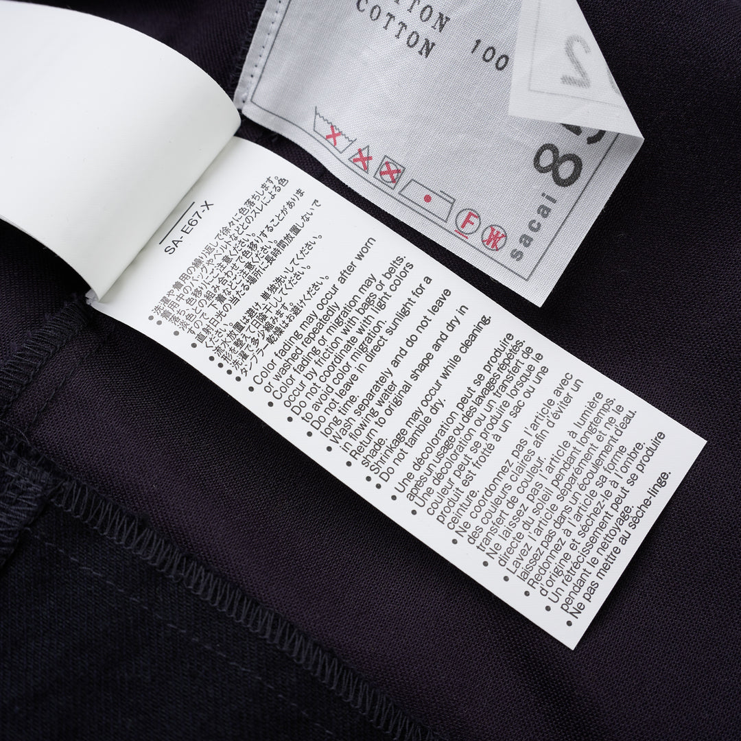 sacai belted peplum denim midi skirt in dark indigo with contrast topstitching, shown from the front - view 8
