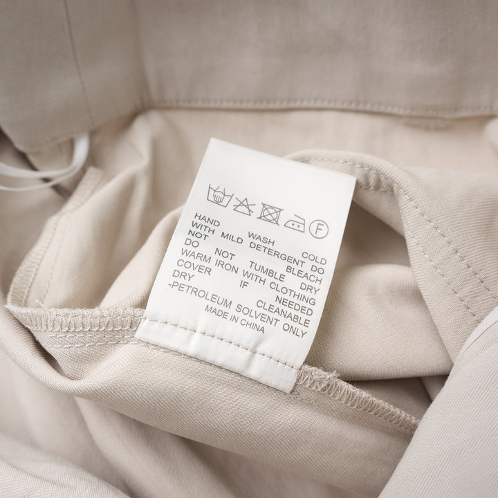 Club21 Collection Adele wide-leg pants in light neutral nylon cotton twill with patch pockets and double button waistband, front view - view 4
