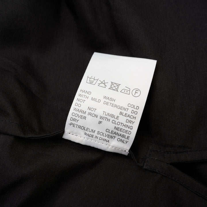 Black sheer silk cotton button-up shirt with stand collar and extended long sleeve cuffs, front view - view 4