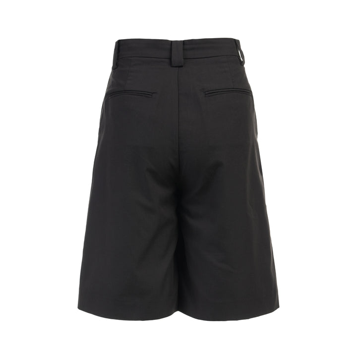 Black longline tailored shorts with a front box pleat, belt loops and concealed fly closure, shown from the front - view 2
