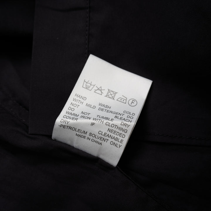 Black sleeveless cotton shirt with mandarin collar, pleated bib front and self-tie waist belt - view 4