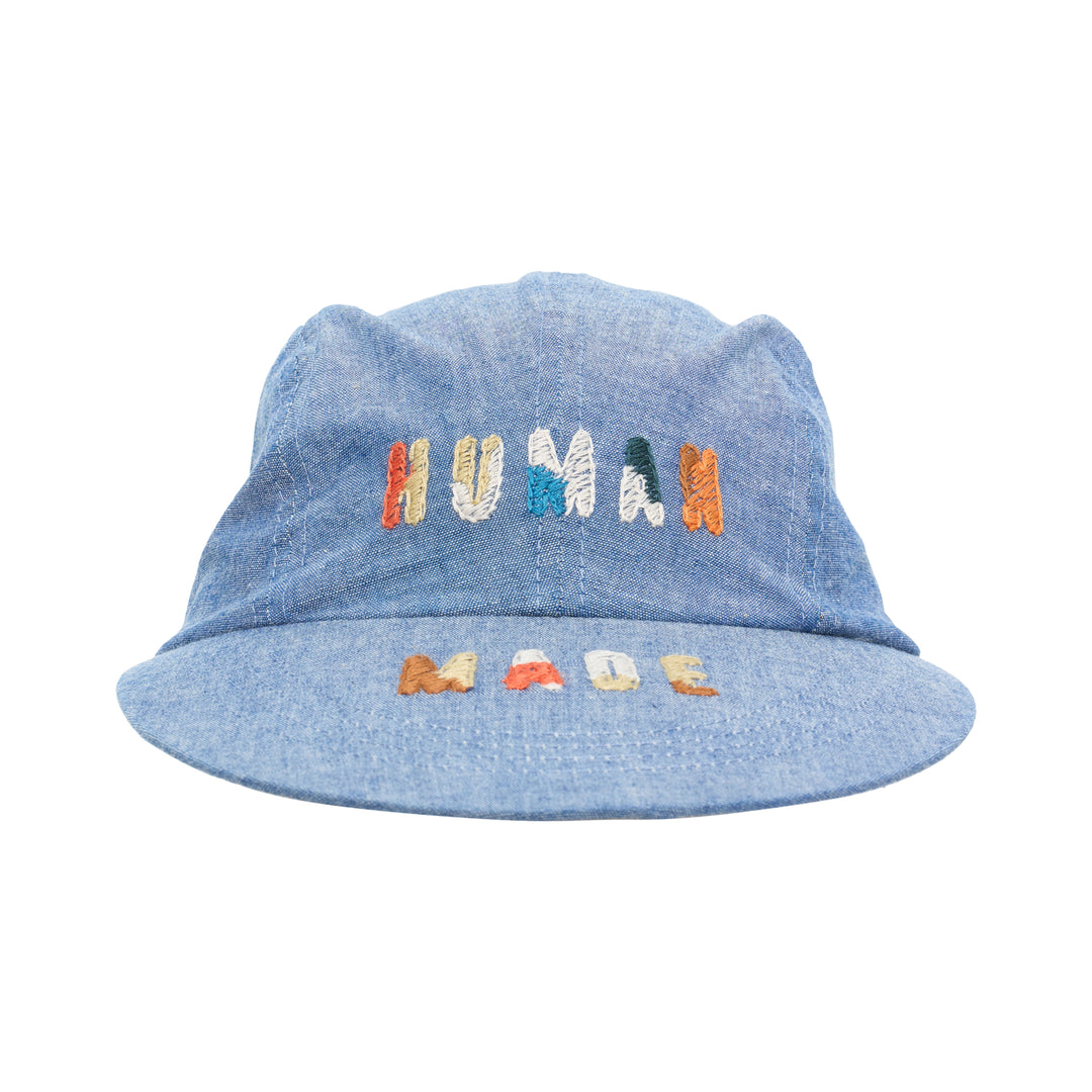 Human Made 4-panel chambray cap in washed blue with multicolour embroidered HUMAN lettering on the crown and MADE on the brim