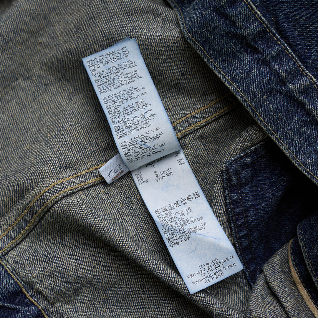 Human Made washed indigo denim work jacket with pleated front, button closure and heart-shaped logo patch on the chest - view 5