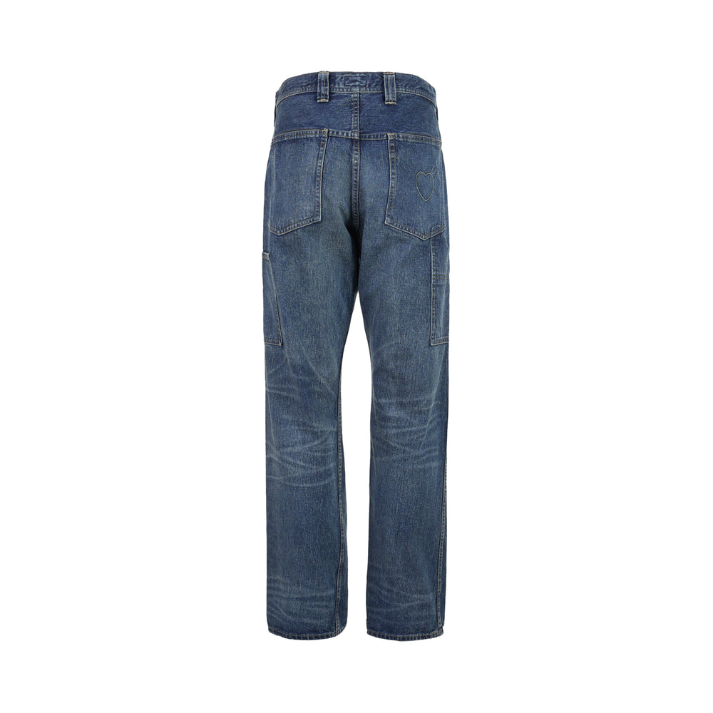 Human Made slim denim pants in a washed mid-indigo finish, shown front-facing with button fly and contrast topstitching - view 2