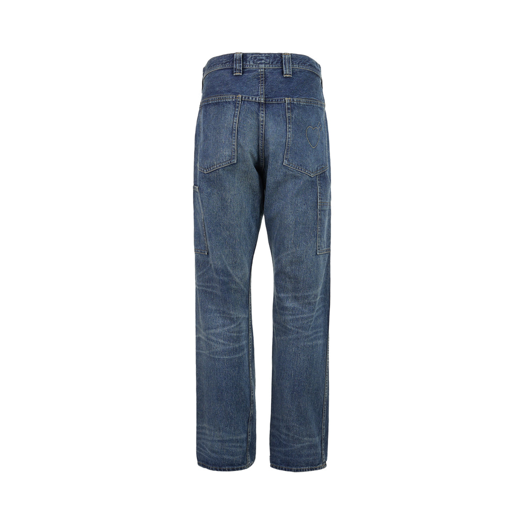 Human Made slim denim pants in a washed mid-indigo finish, shown front-facing with button fly and contrast topstitching - view 2