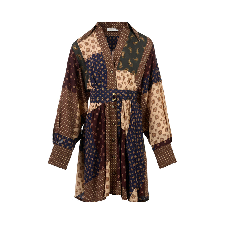 Zimmermann Tuck Mini Dress in brown, navy, cream and olive patchwork print with paisley and medallion motifs, V-neck collar, button front, long sleeves and belted waist