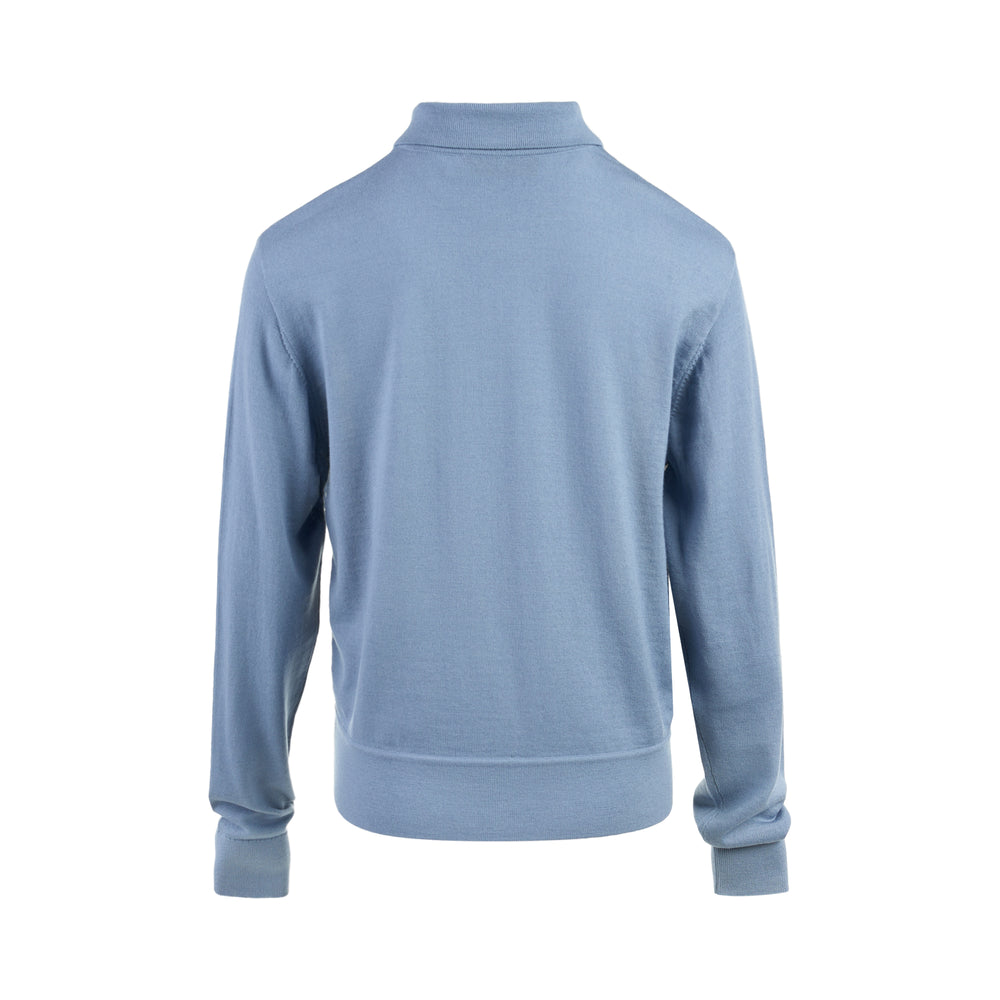 Zimmermann Valiant long sleeve polo with a silk front panel printed with a vintage world map and aeroplanes, framed by blue knit collar, sleeves, and hem - view 2