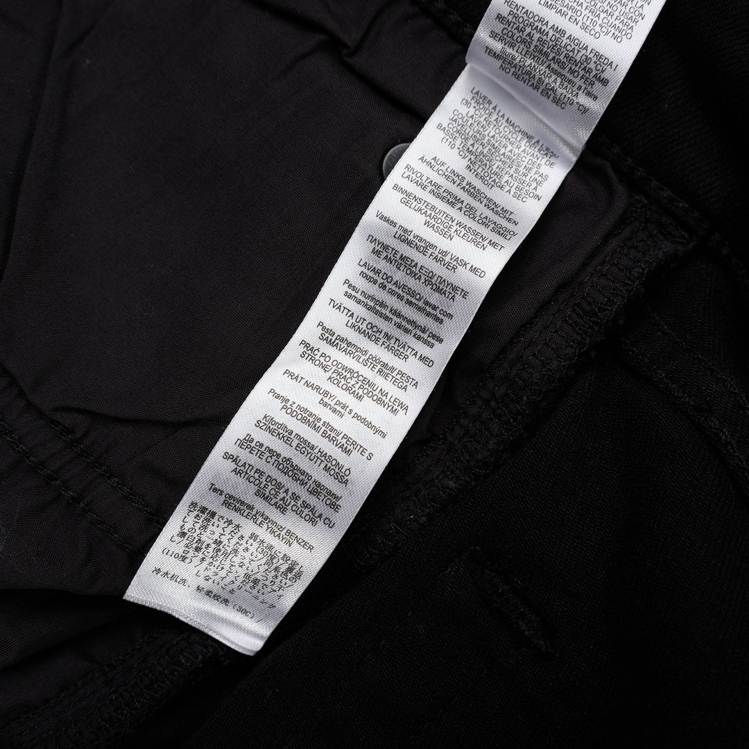 rag & bone Flexi Wren mid-rise full slim jeans in black stretch denim with five-pocket styling and rolled cuffs, shown from the front - view 5