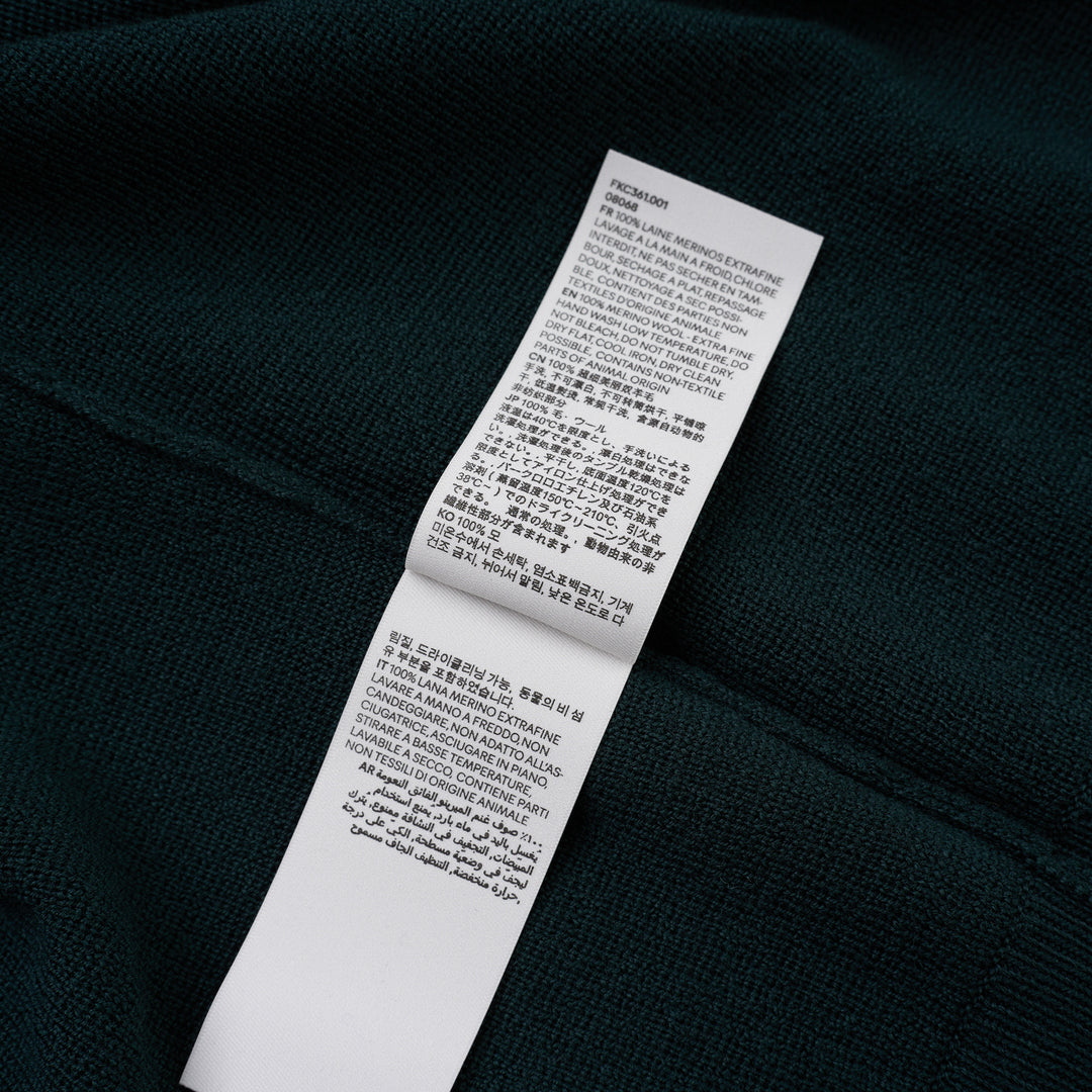 AMI Quota crewneck cardigan in deep forest green with black buttons, ribbed hem and cuffs, and a tonal embroidered heart logo on the chest - view 4
