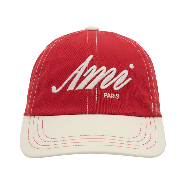 AMI bicolor baseball cap in red with a cream peak, featuring white script logo embroidery, Paris lettering and contrast stitching