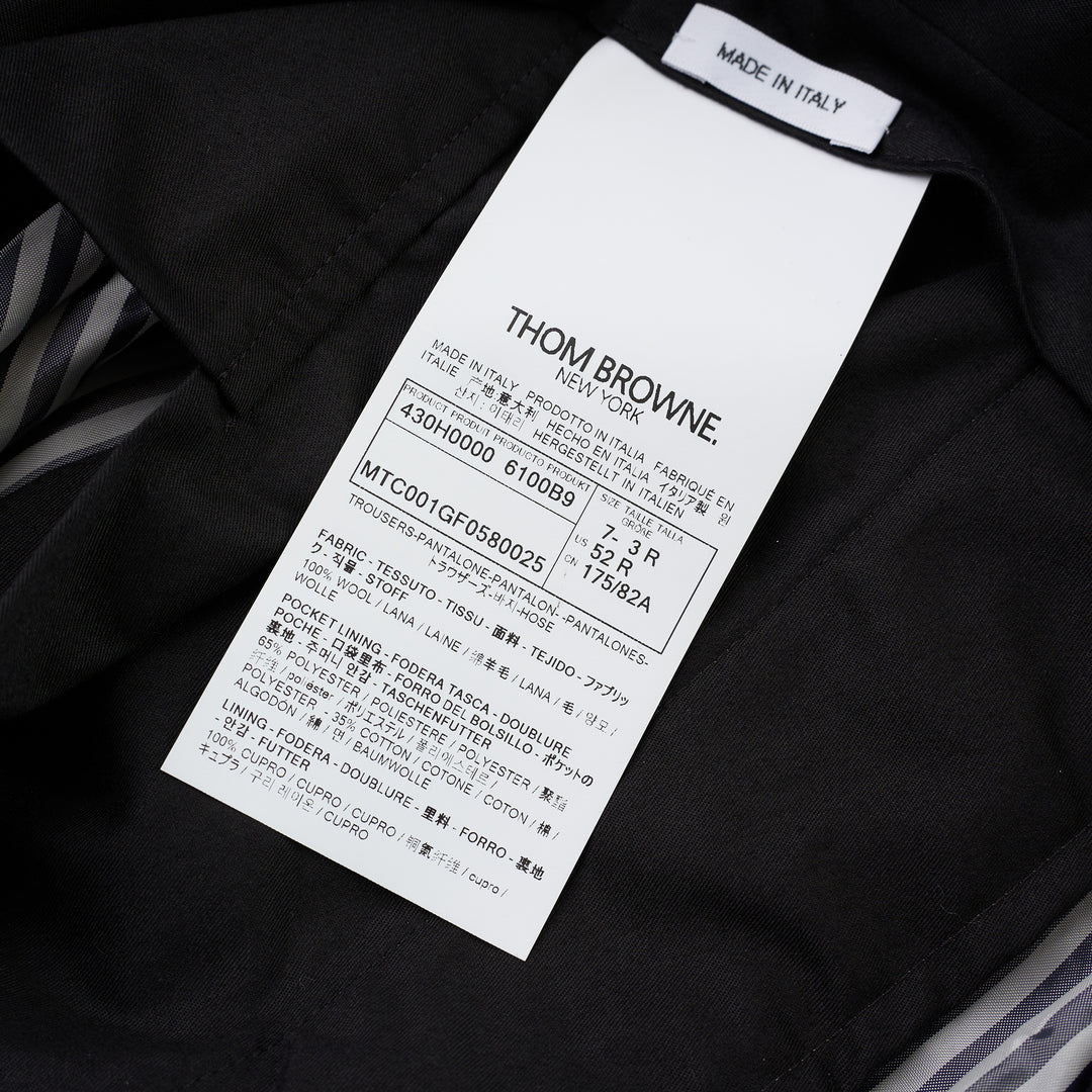 Thom Browne Fit 1 backstrap trousers in charcoal grey with flat front and slim straight leg, shown front view - view 3