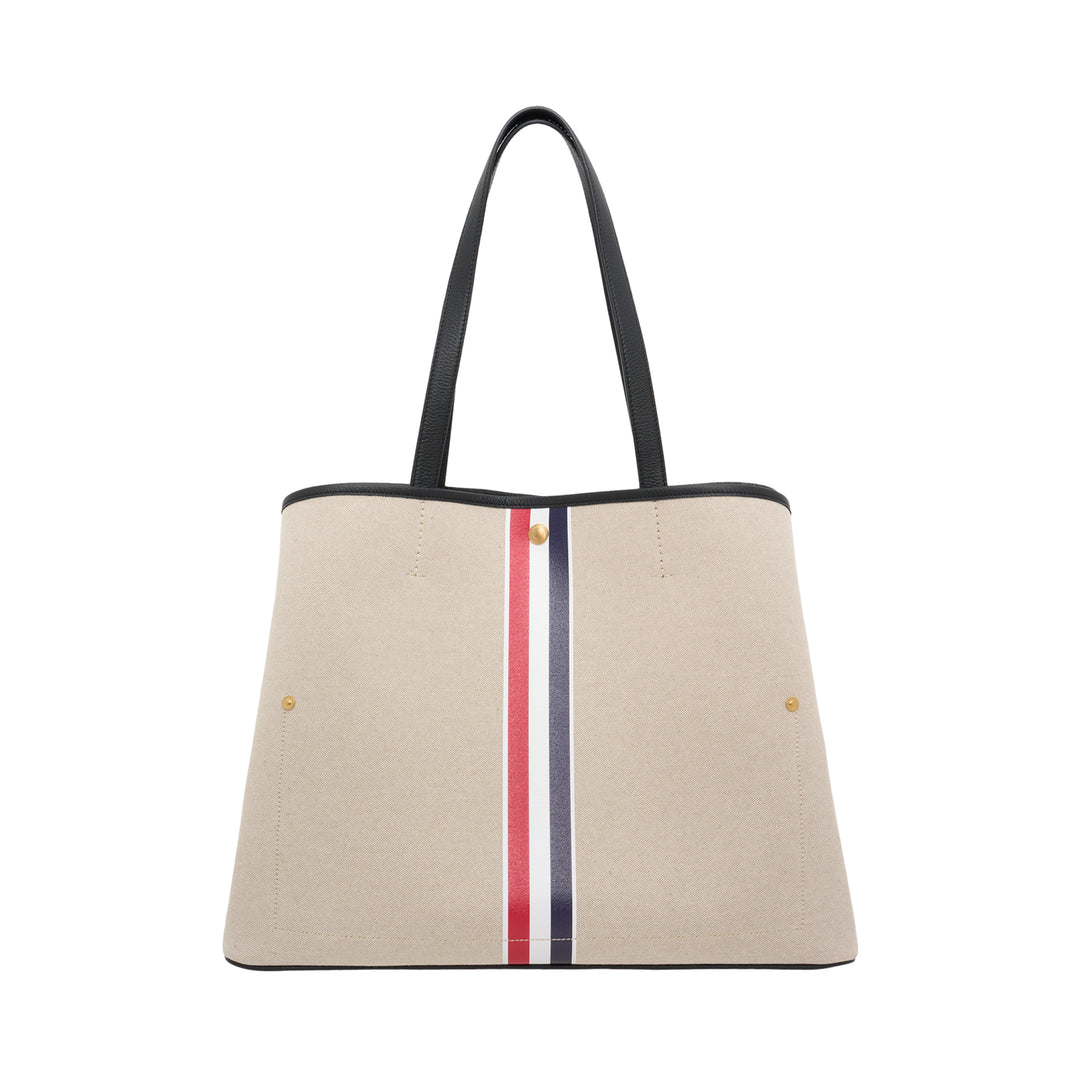 Thom Browne horizontal canvas tote bag with black leather handles, gold-tone studs and a red, white, and blue vertical stripe