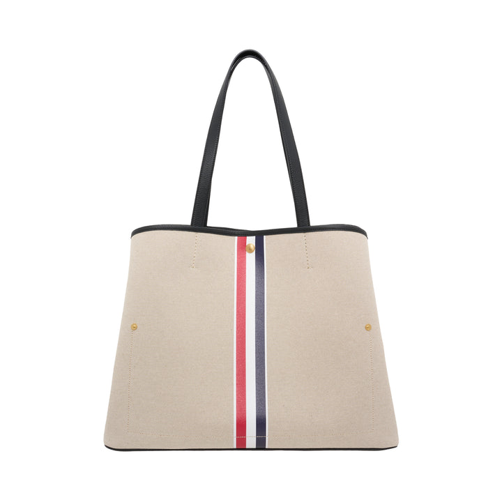 Thom Browne horizontal canvas tote bag with black leather handles, gold-tone studs and a red, white, and blue vertical stripe