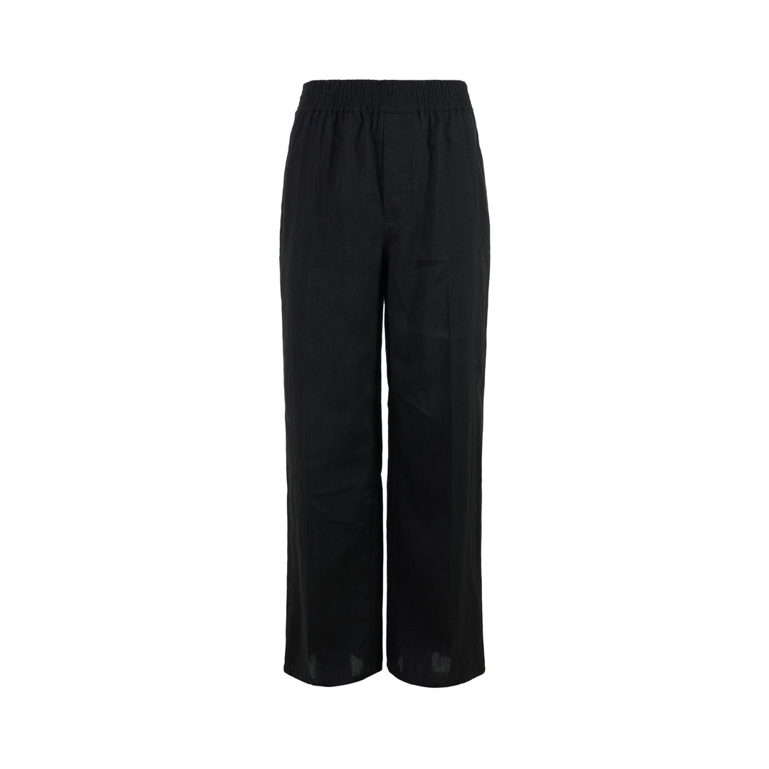 Jacquemus Miami black wide-leg trousers with a smocked elasticated waistband, shown from the front