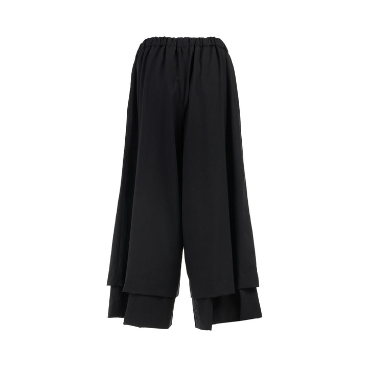 Comme des Garçons black wool georgette wide-leg pants with an elasticated waist and double-layered hem, shown from the front - view 2