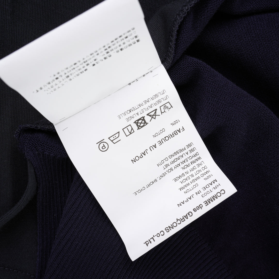 Comme des Garçons Homme navy fine-knit tee with contrasting black short sleeves, ribbed crew neck and hem, shown flat from the front - view 4
