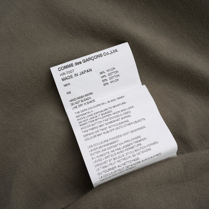Comme des Garçons Homme olive green snap button cardigan with ribbed V-neck, sleeve zip pocket and ribbed hem - view 4