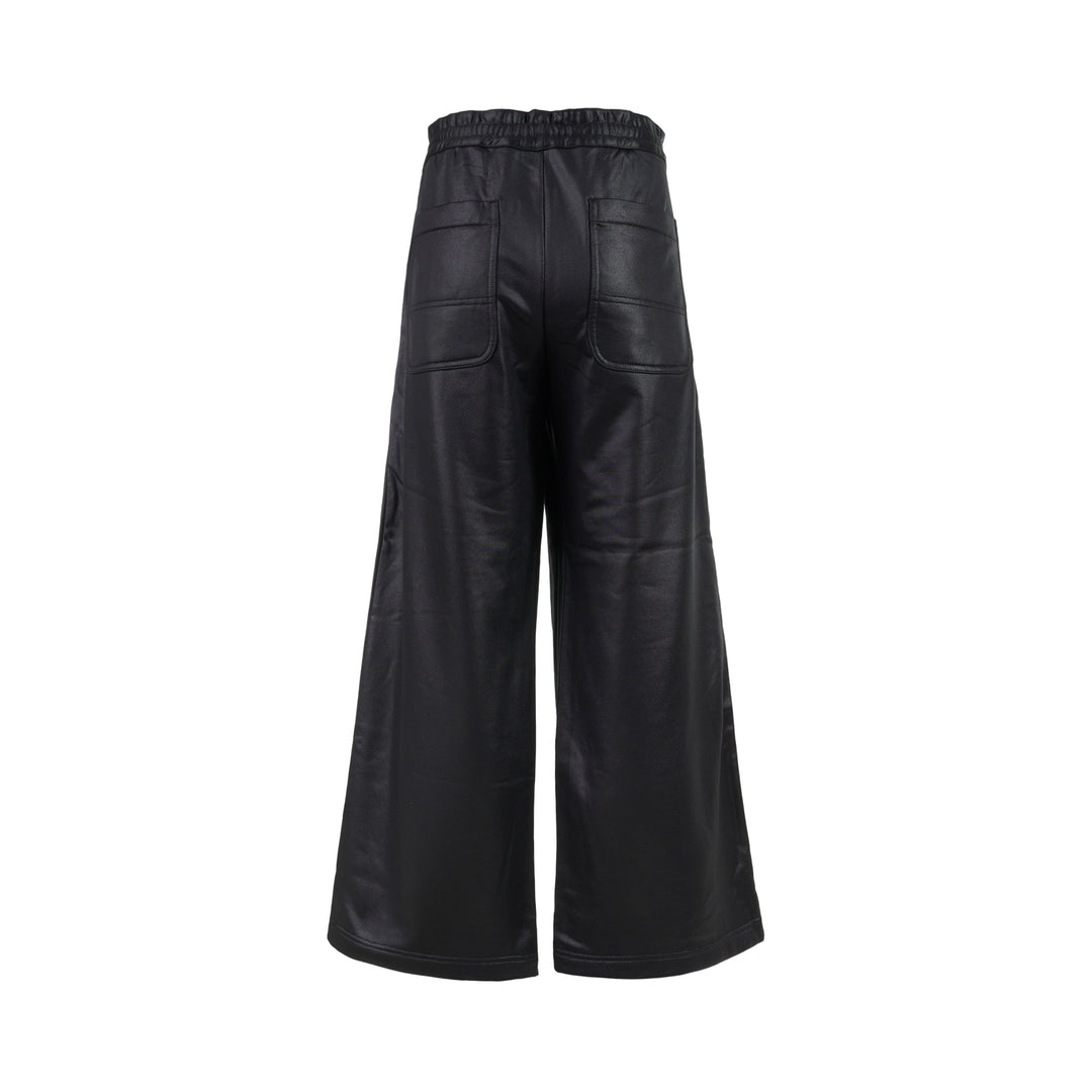 Comme des Garçons Homme Plus black gloss finish wide-leg flared pants with elasticated waistband, shown from the front - view 2
