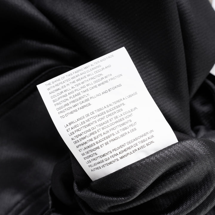 Comme des Garçons Homme Plus black gloss finish wide-leg flared pants with elasticated waistband, shown from the front - view 3
