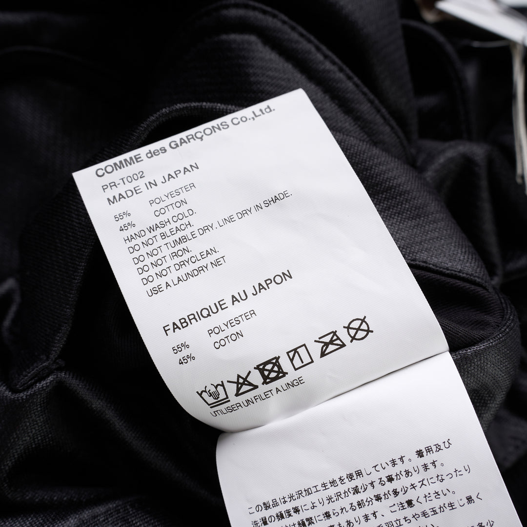 Comme des Garçons Homme Plus black gloss finish wide-leg flared pants with elasticated waistband, shown from the front - view 4