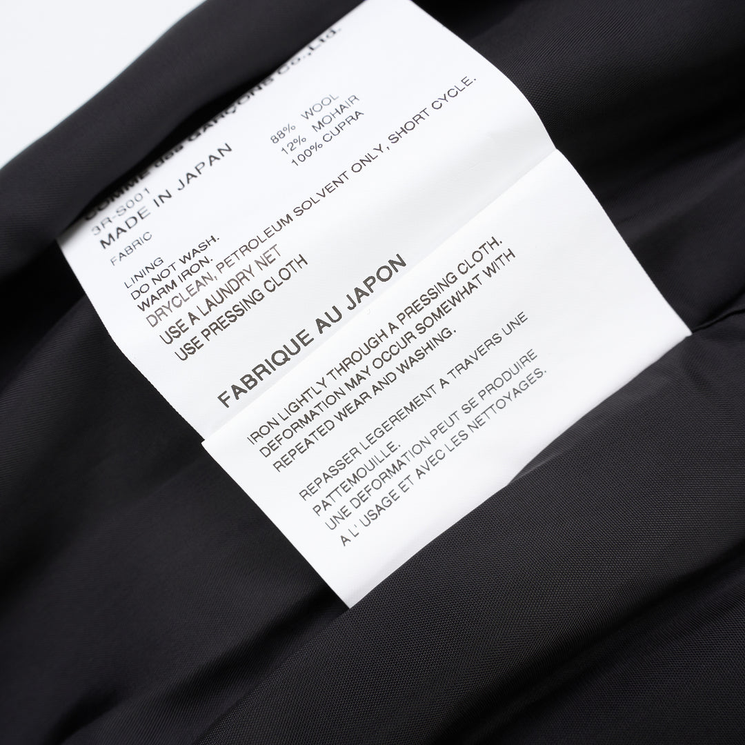 Noir Kei Ninomiya black wool doeskin midi skirt with an oversized sculptural bow, gathered elastic waist and bubble hem - view 5