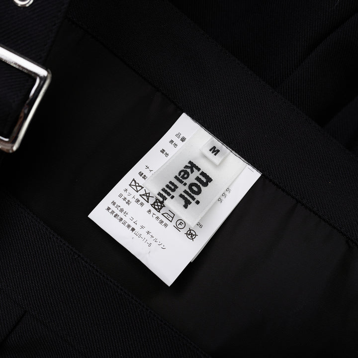 Noir Kei Ninomiya black pleated vest in wool polyester gabardine with grommet-studded buckle straps and layered peplum - view 3