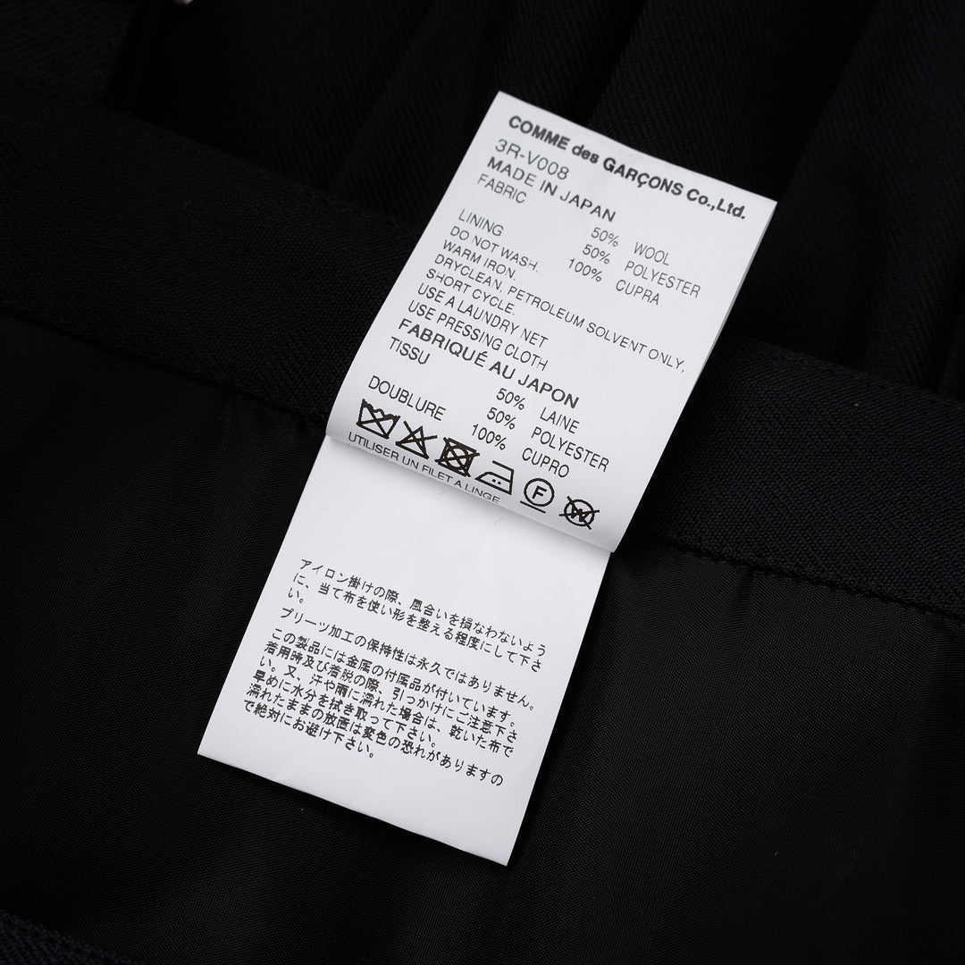 Noir Kei Ninomiya black pleated vest in wool polyester gabardine with grommet-studded buckle straps and layered peplum - view 5